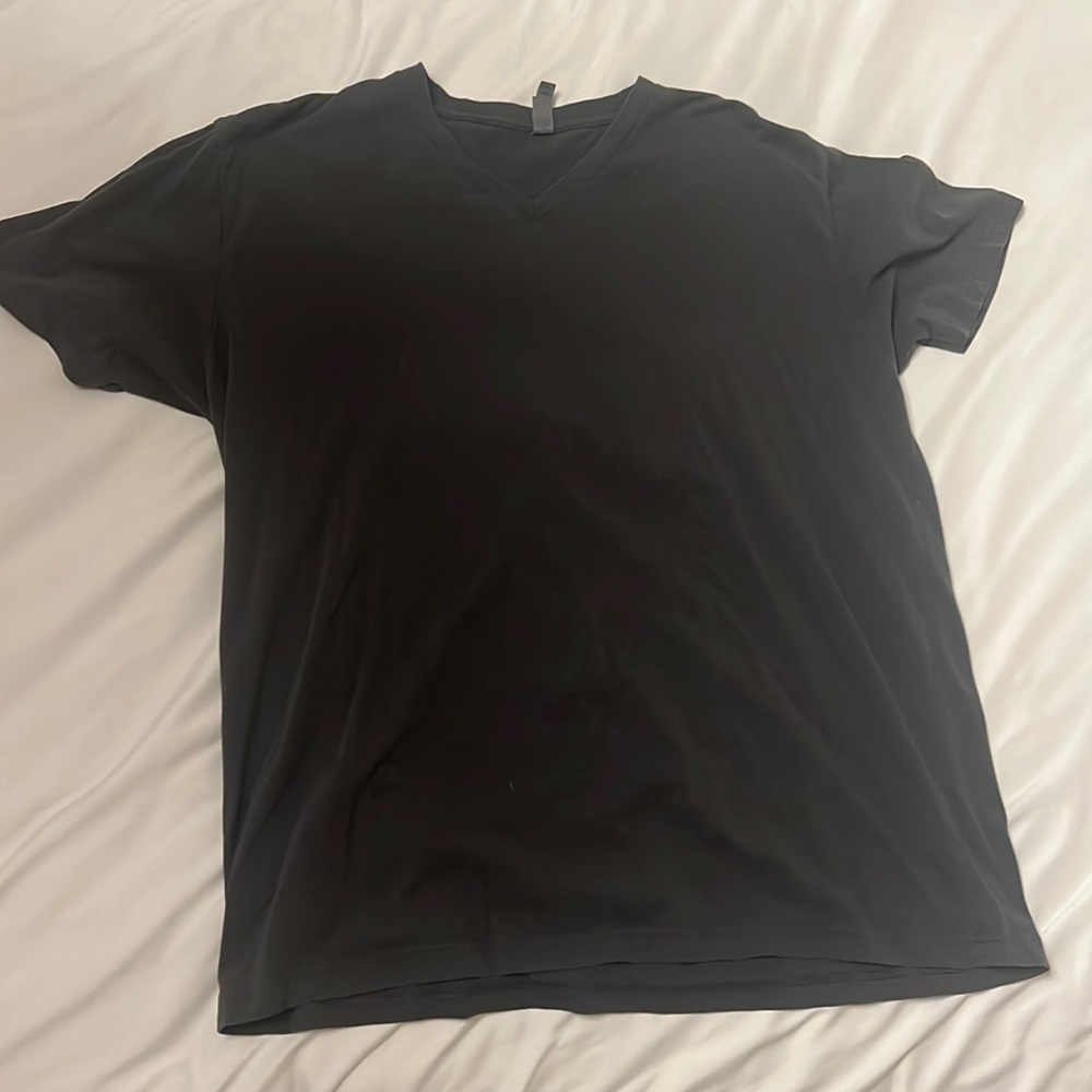 Two different shirts from next level apparel, light, blue, and gray size XL